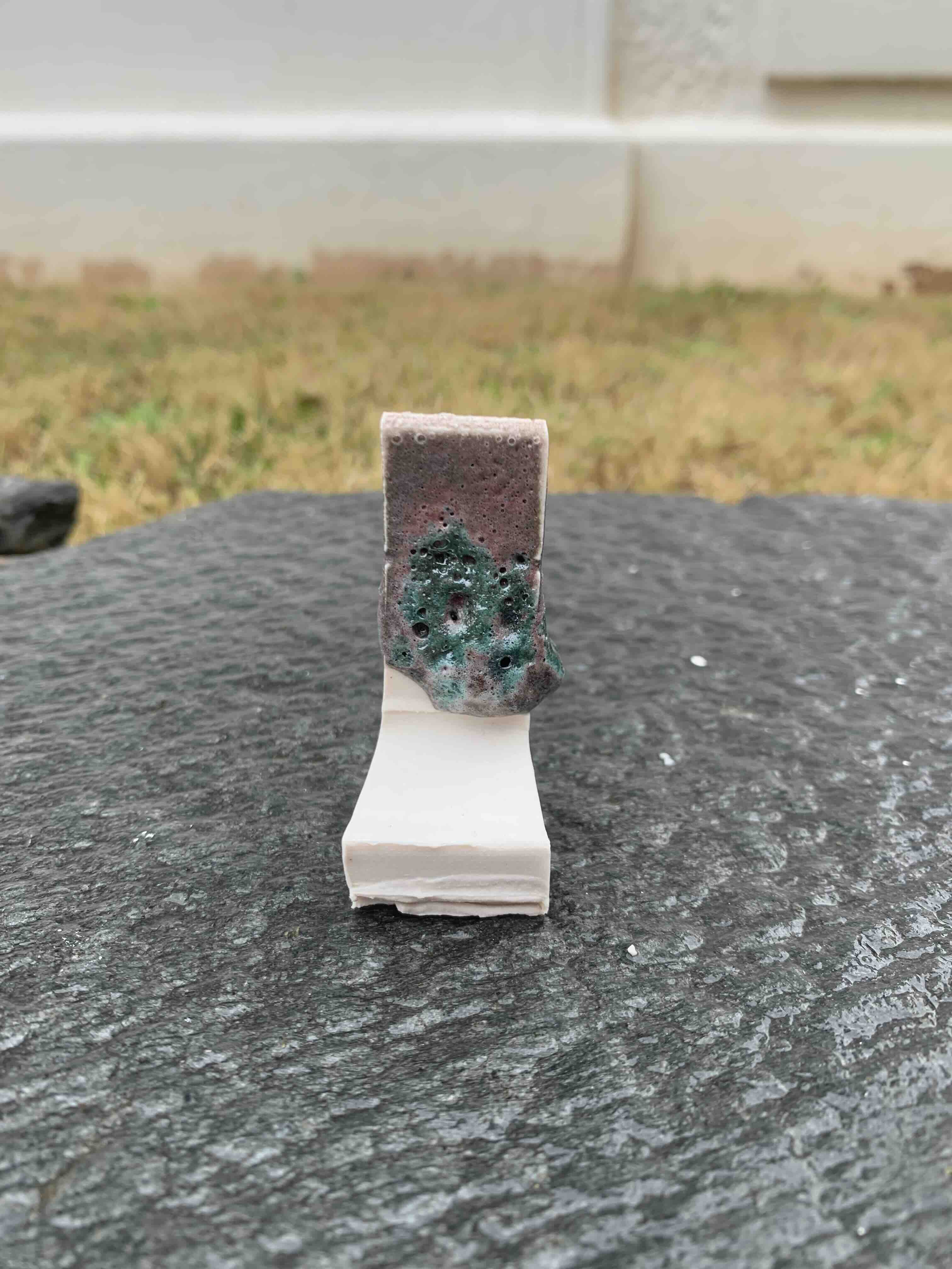 a bubly bluish redish glaze